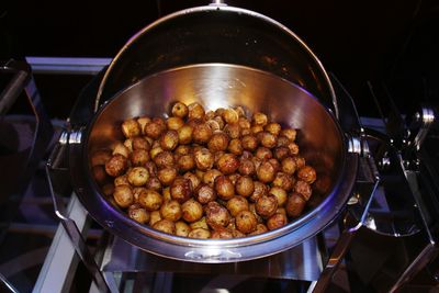 High angle view of prepared potatoes in utensil at kitchen