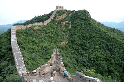 Old ruins on mountain against sky