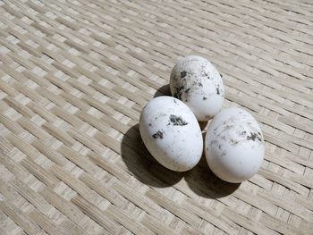 High angle view of eggs on wicker