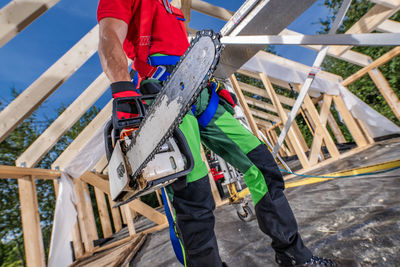 Low section of man working at construction site