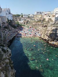 High angle view of townscape by sea