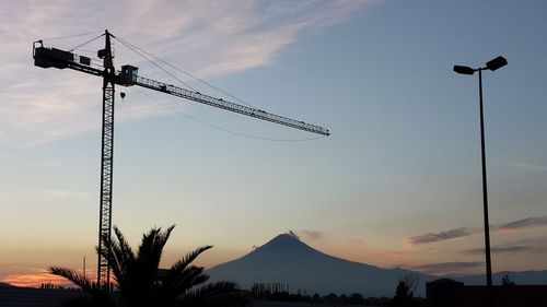 Low angle view of silhouette mountain against sky during sunset