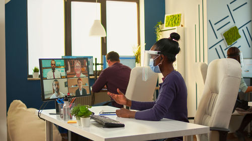 Business people talking on video conference in office