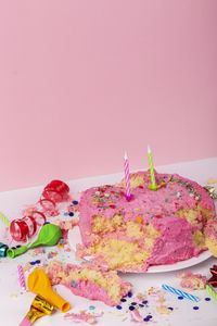 Birthday cake over pink background