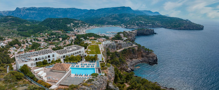 Aerial view of the luxury cliff house hotel on top of the cliff on the island of mallorca.