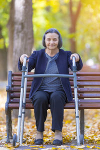 Portrait of smiling woman sitting on seat