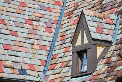 Low angle view of house roof tiles