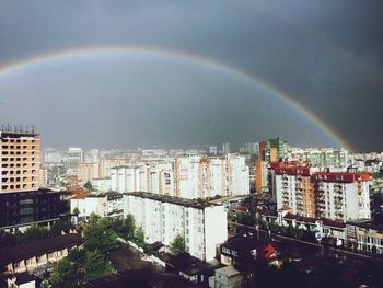 Rainbow over cityscape