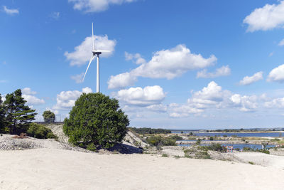 Scenic view of beach against blue sky