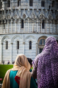 Rear view of women standing in city