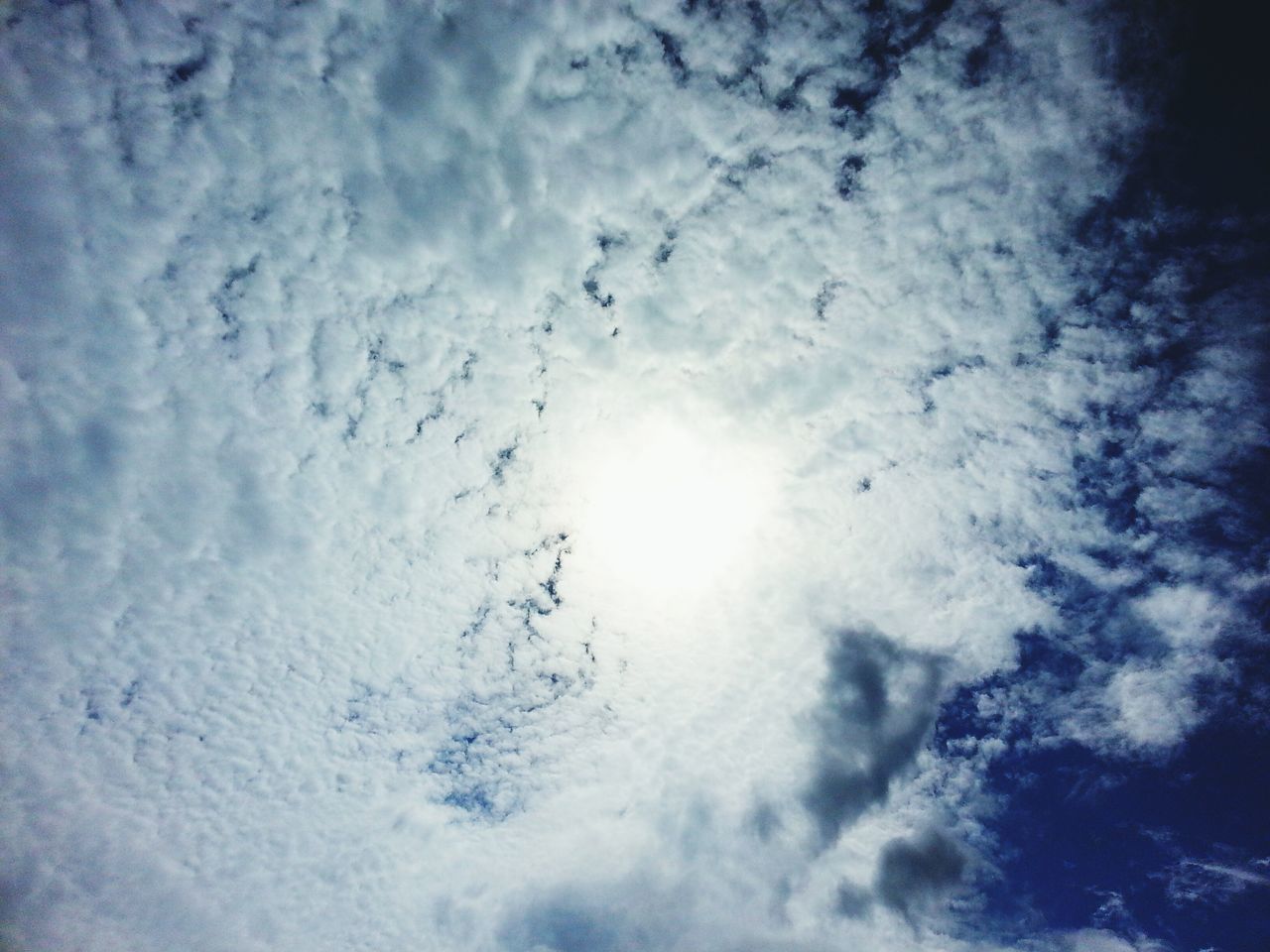 low angle view, sky, cloud - sky, beauty in nature, sky only, nature, backgrounds, tranquility, full frame, scenics, cloudy, weather, tranquil scene, idyllic, cloud, day, white color, no people, outdoors, blue