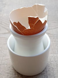 High angle view of broken egg shell on table