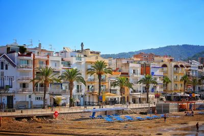 Town against clear blue sky