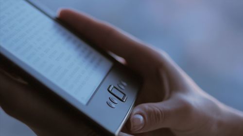 Close-up of woman hand using mobile phone