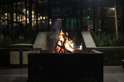 Fire hydrant on barbecue at night