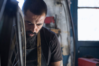 Midsection of man working at bus