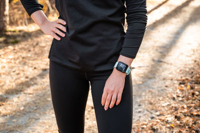 The figure of a girl with a smart watch with a fitness tracker, about health during sports