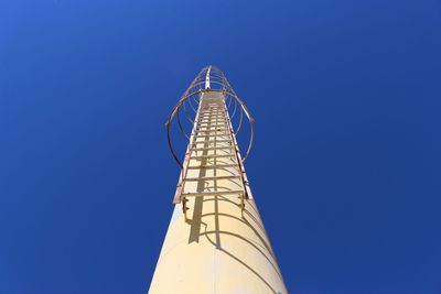 Low angle view of tower against clear blue sky