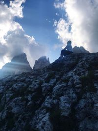 Low angle view of rock formation against sky