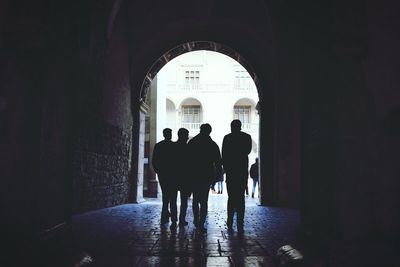 Full length of woman walking in tunnel