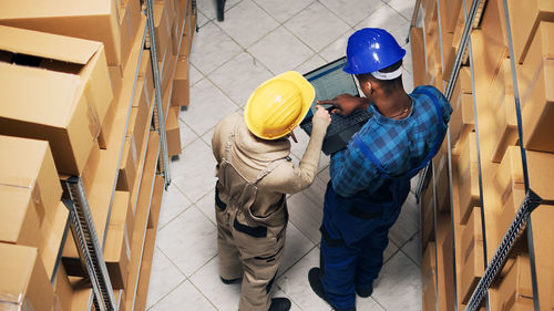 Rear view of man working at construction site