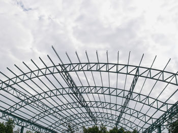 Low angle view of metallic structure against sky