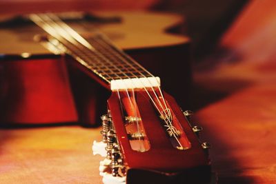 Close-up of guitar on table