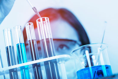 Female scientist holding medical sample at laboratory