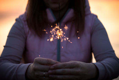 Midsection of woman holding hands