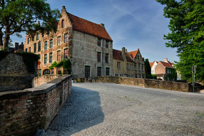 Street amidst buildings against sky