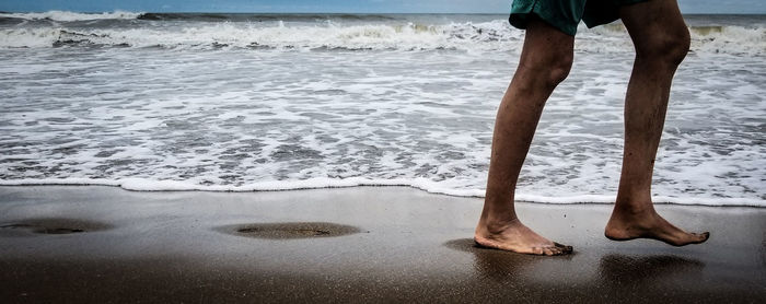 Low section of man on beach