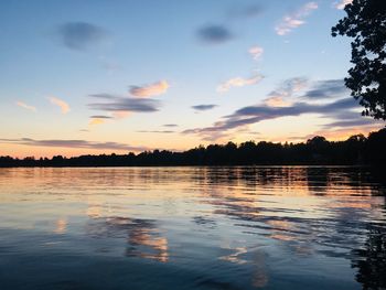 Scenic view of lake against sky during sunset