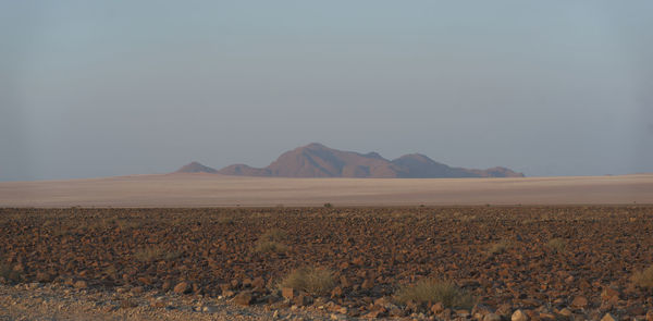 Scenic view of desert against clear sky