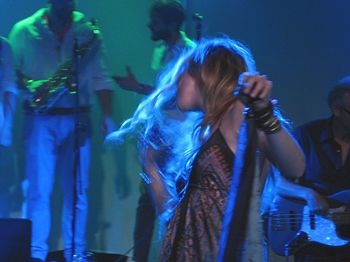 Rear view of woman enjoying music concert