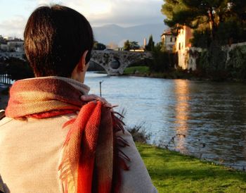 Rear view of man looking at river