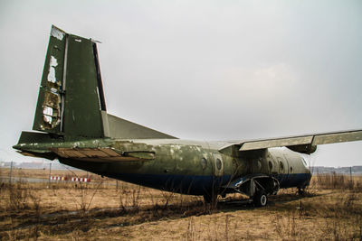 Abandoned car on field