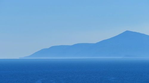 Scenic view of sea against clear blue sky