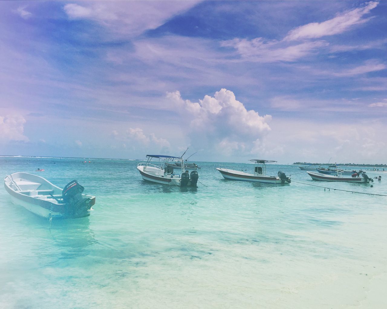 nautical vessel, transportation, boat, water, sea, mode of transport, sky, horizon over water, scenics, tranquil scene, waterfront, ocean, tranquility, cloud, calm, nature, beauty in nature, seascape, cloud - sky, non-urban scene, outdoors, mountain, tourism, majestic, vacations, journey