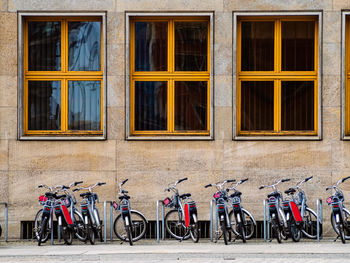 City bicycles on a rack, available for rent. rent a bike in a city. bike sharing