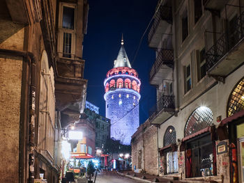 Low angle view of illuminated buildings at night