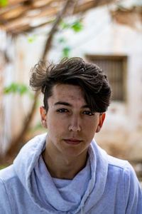 Portrait of young man standing outdoors