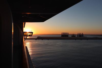 Cruise ship sailing into port at dawn