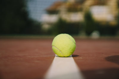 Close-up of tennis ball on playing field