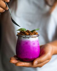 Midsection of woman holding dessert