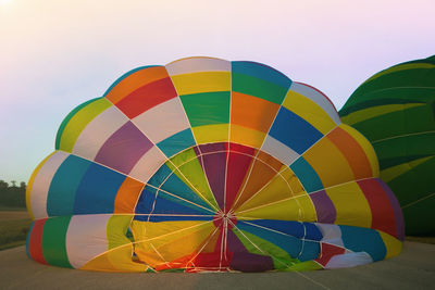 Colored hot air balloon at sunrise in umbria