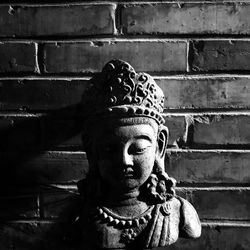 Close-up of statue against wall