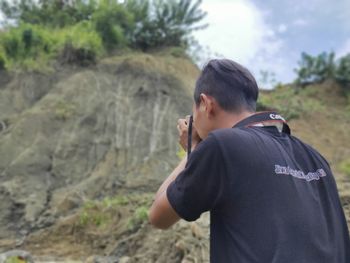 Side view of young man looking away