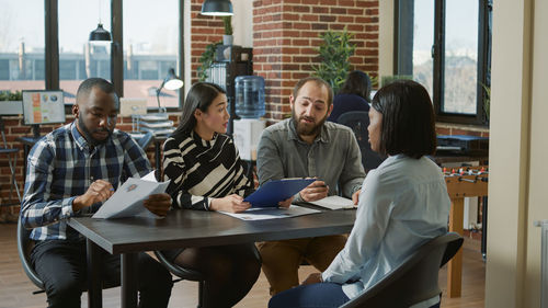 Managers taking interview in office