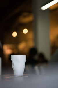 Close-up of coffee cup on table