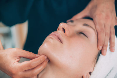 Close-up of woman getting massage therapy at spa